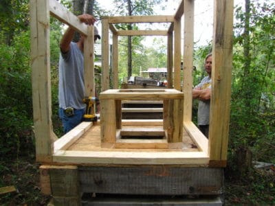 Carpenters building compost toilet