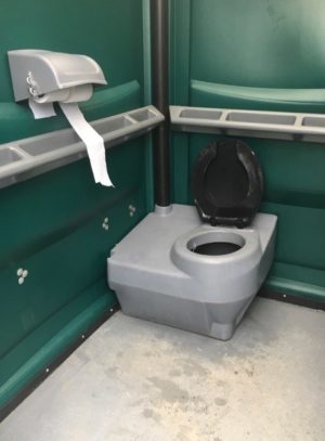Inside picture of portable comfort room with toilet paper