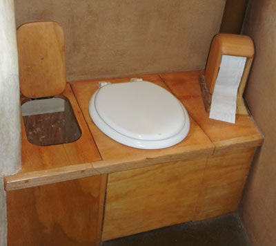 Compost toilet with toilet paper holder
