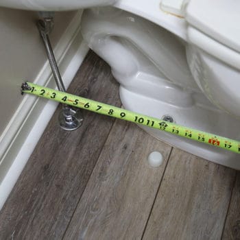 Tape measure measuring the width from the wall