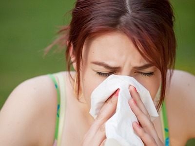 sneezing woman