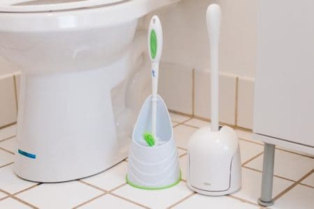 Cleaning brushes besides toilet